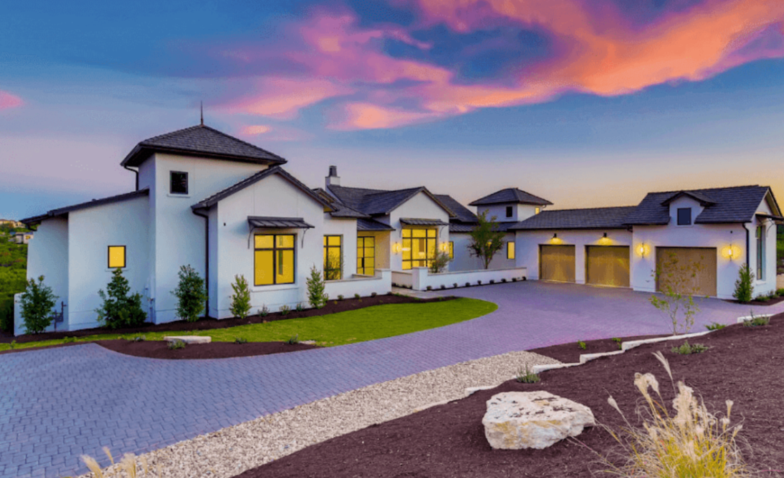 Luxury mansion exterior at dusk